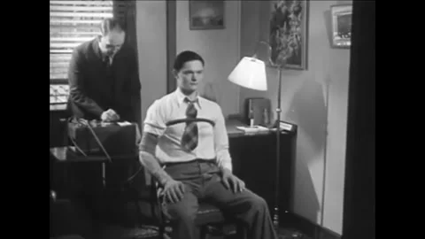 1930s - A policeman demonstrates how to use and read results of a polygraph Stock-Footage 155856100