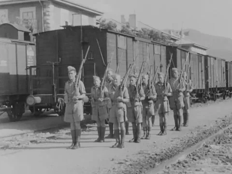 1930s: Soldiers guarding train Stock Footage 158024685
