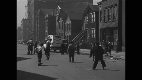 1930s - Traffic periodically interrupts a pickup game of baseball played by Stock Footage 125696967