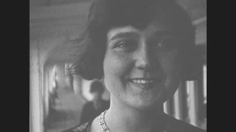 1930s: Women Pose For Close Ups On Ship Deck, Woman Plays Instrument. Girls Stock Footage