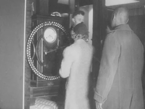 1930s: Workers clocking in Stock Footage 157946243