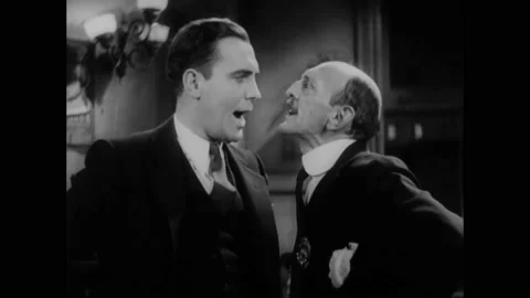 1931 - In this American pre-code comedy drama film, two men get into an argument Stock Footage 241667811