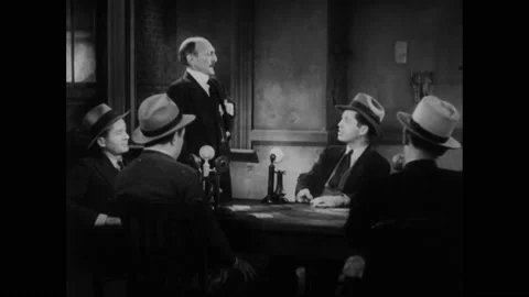 1931 - In this American pre-code comedy drama film, a man discusses newspaper Stock Footage 241668270