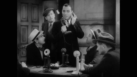 1931 - In this American pre-code comedy drama film, a group of men sit around a Stock Footage 241669750