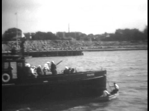 1932 Universal newsreel footage of frenzied men throwing vegetables. Stock Footage