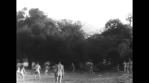 1933 - Nudists play baseball for an assembled nudist crowd. Stock Footage 161229331