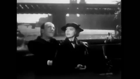1933 - In this pre-code comedy, a man offers to walk a woman home at the end of Stock Footage 246359100