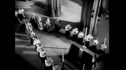 1933 - In this pre-code comedy, a man cries and interrupts a procession in a Stock Footage 246361097