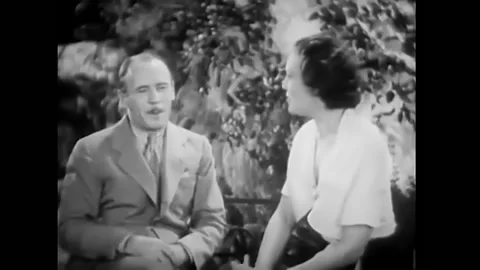 1933 - In this pre-code comedy, a woman misinterprets what a man says to her and Stock Footage 246363705