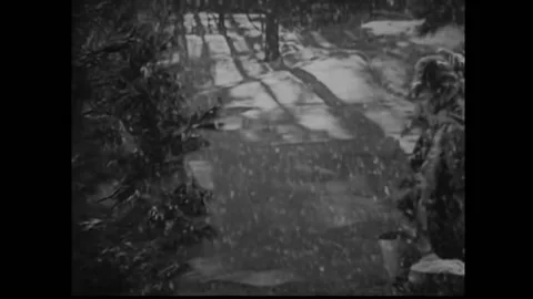 1933 - In this pre-code western comedy, a man blows into a horn to get a group Stock Footage 241783141