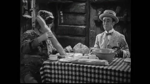 1933 - In this pre-code western comedy, a family cry together at the table as Stock Footage 241783145