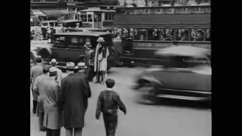1933 - A traffic cop issues tickets for jaywalkers in an American city (narrated Stock Footage 164458214