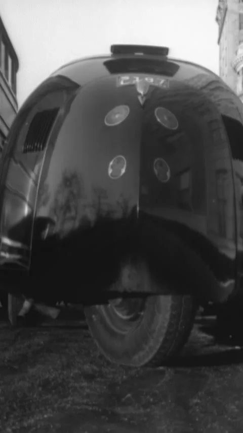 1934 - An experimental dymaxion car is driven and parallel parked. Video stock 287569256