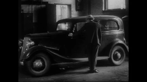1934 - Law enforcement tracks down John Dillinger and catches him outside the Stock Footage 139486748