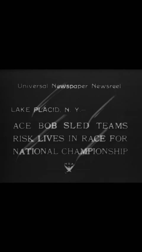 1934 - Men participate in a bobsled competition. Stock Footage 287574613