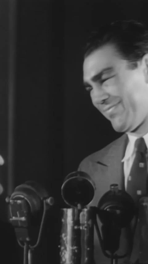 1936 - Max Schmeling smiles at a press conference before a fight with Joe Louis Stock Footage 287586465