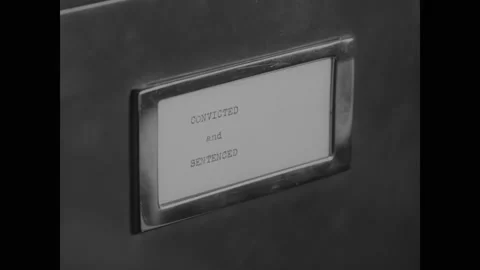 1937 - Case files get thumbed through in Thomas Dewey's office. Stock Footage 166830595