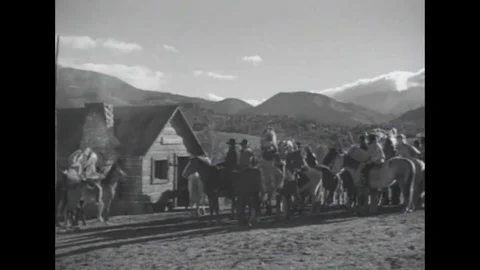 1937 - In this western film, a group of cowboys and Indians chases down a cattle Stock Footage