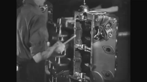 1938 - Car components are put together on an assembly line and men sharpen tools Stock-Footage 152507595
