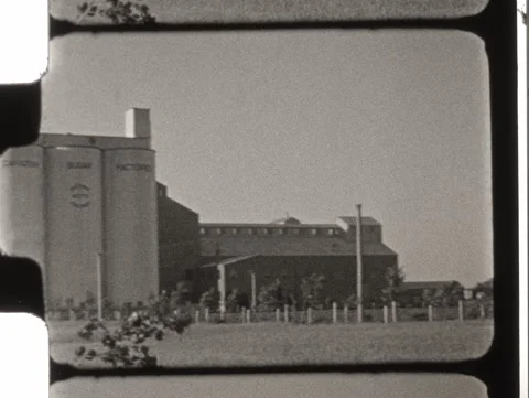  1938 film of a Lethbridge sugar elevator. 8mm 2k overscan Stock Footage 324811744