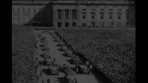 1938 - A large crowd assembled in the Ringstrasse in Vienna, Austria, and Adolf Stock Footage 232892646