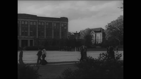 1939 - After leaving class, students walk along campus paths at Tuskegee Stock Footage 166830480
