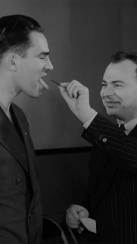 1939 - A daredevil eats razor blades and fire in New York, New York. Stock Footage 284130809