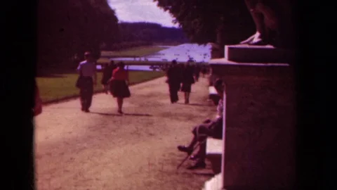 1939: A Group of People Strolling on a Path Toward a Pond in Paris, France Stock Footage 70656213