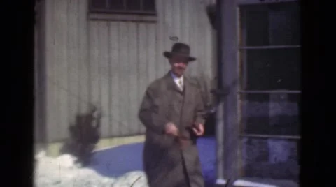 1939: man off to work, what a gentleman. look at those cars! LOS ANGELES, Stock Footage