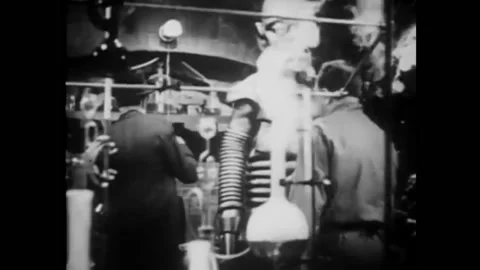 1939 - In this Sci-Fi horror serial, a man flips a switch and his robot attacks Stock Footage 218365638