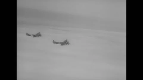 1940 - A squadron of RAF Spitfires in flight. Stock Footage 164592941