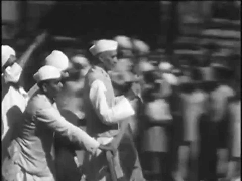 1940s, 1950s -- Indian Prime Minister Jawaharlal Nehru speaks to a large crowd Stock Footage