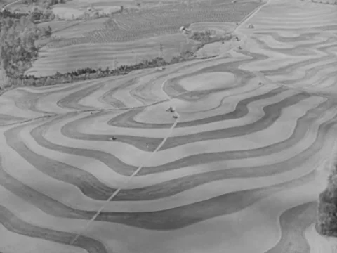 1940s: Aerial shots of patterned fields Stock Footage 221376767