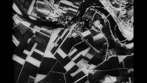 1940s: Aerial view of bombs exploding on ground. Explosions at night. Tank Stock Footage 167959558