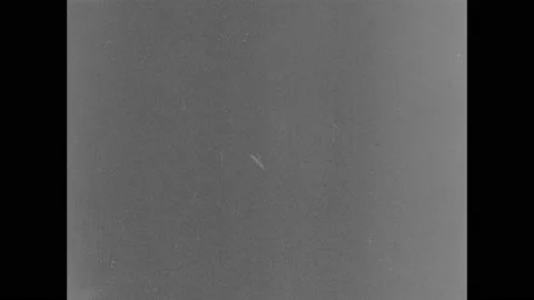 1940s: Airplane spirals towards ground. Plane on fire on ground. People toss Stock Footage 147598528