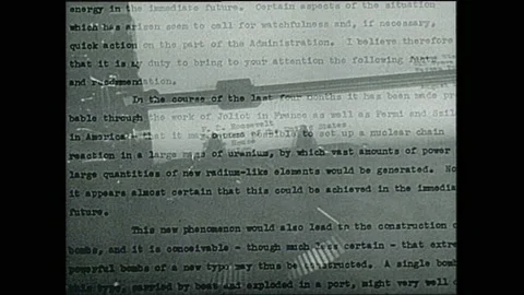 1940s: Albert Einstein sits on deck with man. Typewritten letter from Einstein Stock Footage 153554034
