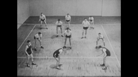 1940s: All-male volleyball match. Volleyball players change positions. Stock Footage