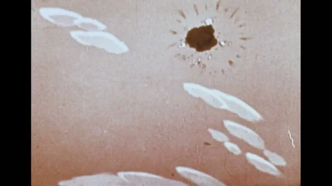 1940s: Animated, plane flying, explodes / Lizard in basket under balloon, looks 스톡 동영상 74866482