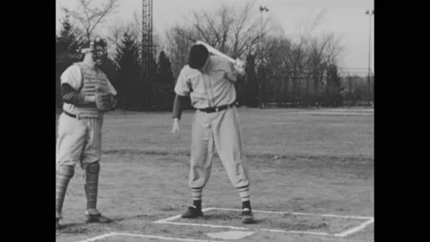 1940s: Baseball player at bat, swinging, hitting ball. Slow motion shots, player Stock Footage 168263620