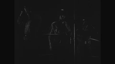 1940s : A battleship opens fire on another ship at night/ men plot coordinates Vídeos de archivo 74657673