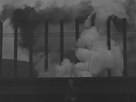 1940s: Billowing smokestacks Stock Footage 229206587