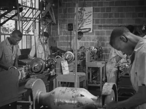 1940s: Black students work on grindstones Video stock 229754292