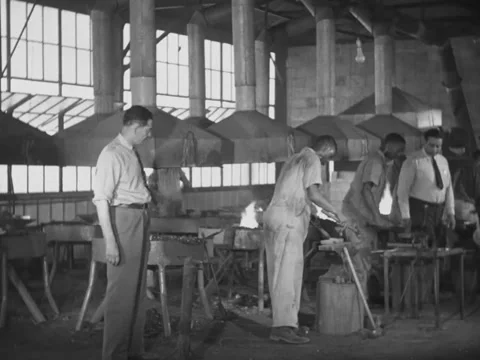 1940s: Blacksmithing students Stock Footage 229754284