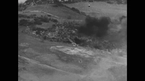 1940s: Bomb explodes. Soldiers look through binoculars and telescopes. Soldiers Stock Footage 140893339