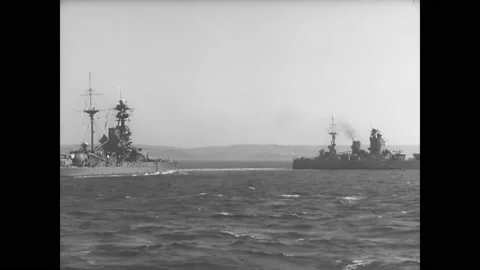 1940s - A British Navy fleet sails past a submarine. Stock Footage 159136500