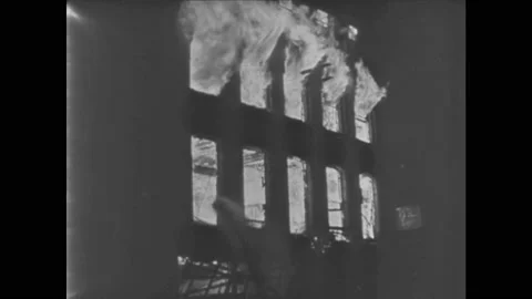 1940s: Buildings burn on fire from bombs. Rubble, destruction, damaged Vídeos de archivo 140892271