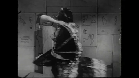 1940s - A burlesque dancer performs a routine with an ancient Egyptian theme. Stock Footage 136191016