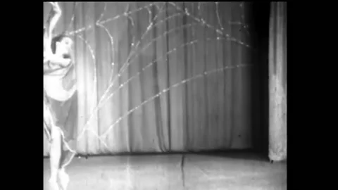 1940s - A burlesque dancer who performs with a cape decorated like butterfly Stock Footage 170511689