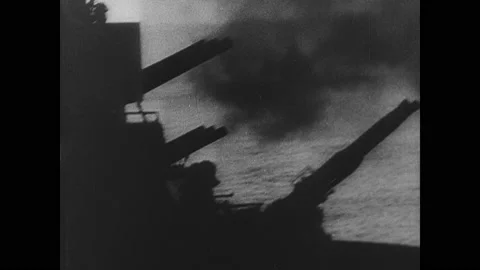 1940s: Cannons on Navy ship raise. Cannons fire. Cannons on ships fire. Soldiers Stock Footage 150347672