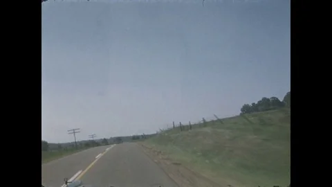 1940s: Car drives down different roads and streets Stock Footage